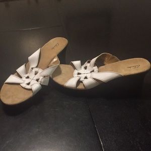 White and black Clark’s sandals
